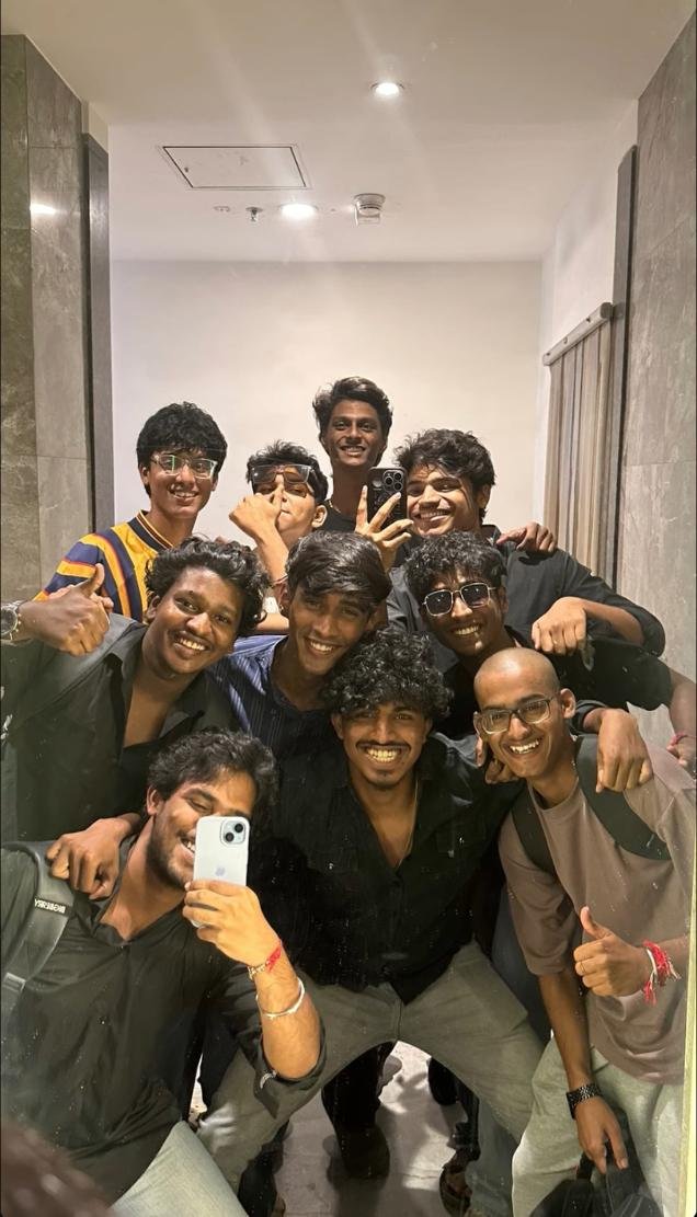 Group of friends laughing together in a photo