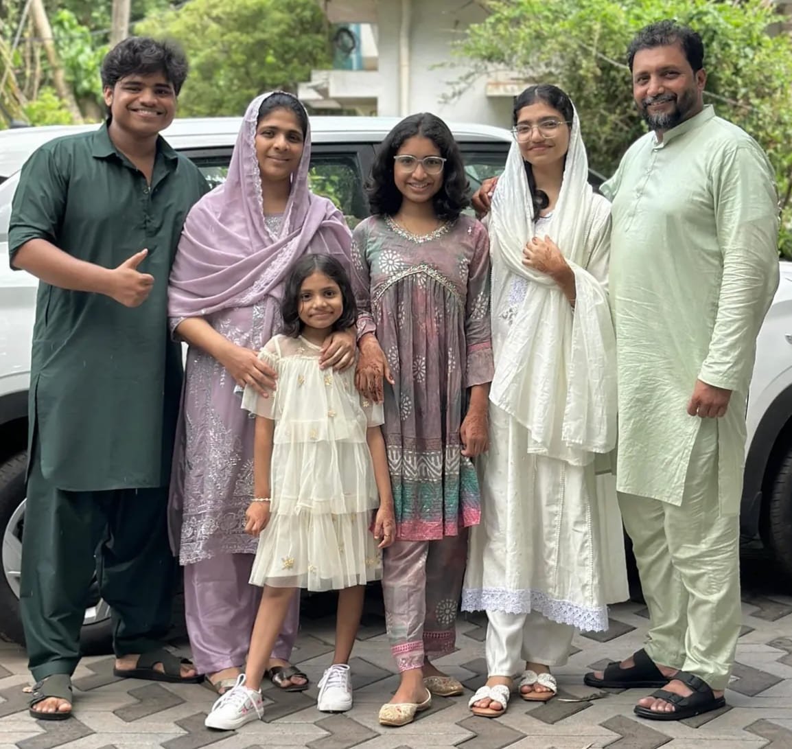 Family portrait outdoors in festive traditional attire